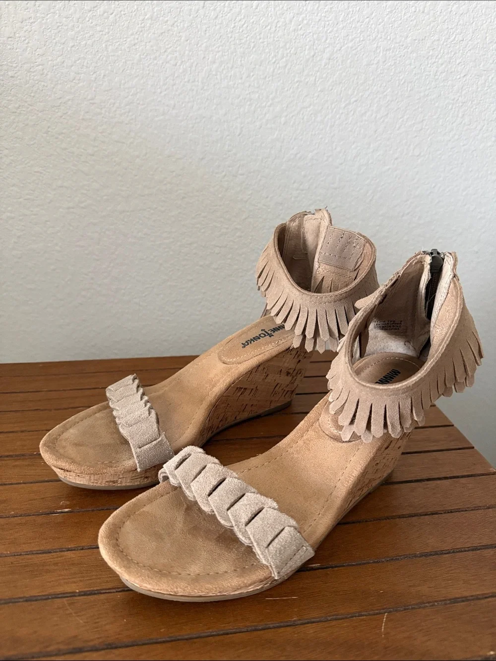 Minnetonka Suede Fringe Wedge Sandals in Tan